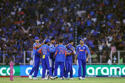 ahmedabad mar 08 ani india39s varun chakravarthy and teammates celebrate the