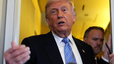 trump speaking to reporters abord the air force one