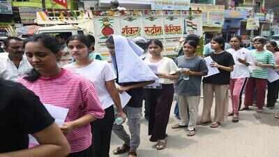 patna jun 21 ani aspirants wait in a queue outside the examination centre to
