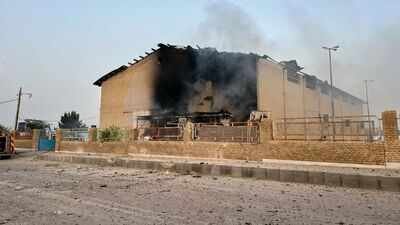 smoke rises from a building damaged in the strike in lamerd ap