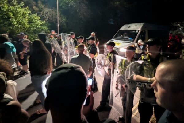 Cops injured vehicles damaged as anti‑migrant protest turns violent in