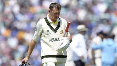 australias marnus labuschagne walks off the pitch after being bowled out by ind