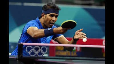 indias sharath kamal achanta plays against chinas fan zhendong during a mens