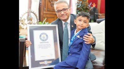 indian american toddler advay jain being felicitated by new york consul general binaya srikanta pradhan for his guinness record