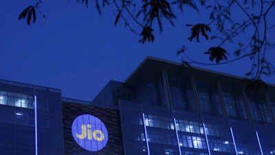 reliance industries jio telecoms logo is displayed on the jio world convention centre building on a street in mumbai